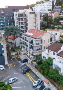 an aerial view of a parking lot in a city at Hotel Butua Residence in Budva