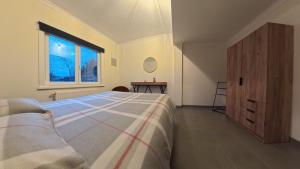 a bedroom with a bed and a window at Aurelia in Zemst