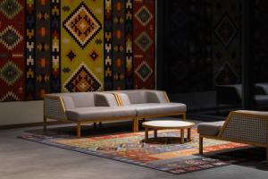 a couch and two chairs and a table on a rug at Mimi Hotel Chisinau Jolly Alon in Chişinău +114 photos