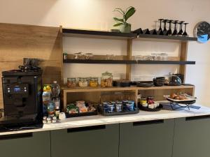 a kitchen with a counter with food on it at B&B Casa Anì in Pordenone
