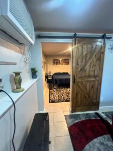 a room with a door leading into a bedroom at Cozy Cove in Lithonia