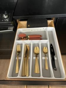 a tray with utensils in a kitchen at Deep Ellum Lux in Dallas