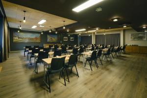 a large room with tables and chairs in it at Bergstadens Hotel & Spa in Røros +134 photos