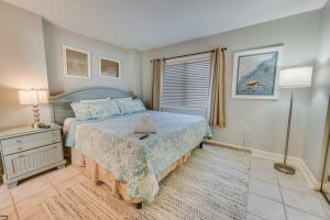 a bedroom with a bed with a stuffed animal on it at Sea Pointe 2BR Condo Oceanview, Views, Large Condo in Myrtle Beach
