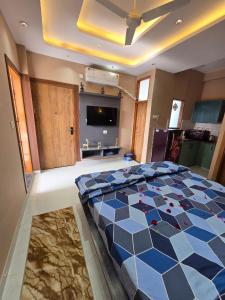 a bedroom with a large bed in a room at The terrace affair studio with jacuzzi in Gurgaon