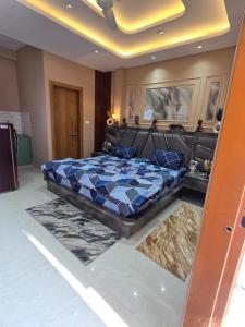 a bedroom with a large bed in a room at The terrace affair studio with jacuzzi in Gurgaon