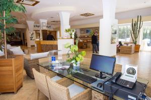 a office with a desk with a computer on it at Joli Park Hotel - Caroli Hotels in Gallipoli