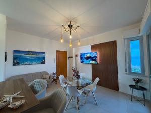 a living room with a couch and a table at La Perla Saba 2 in Montemarciano