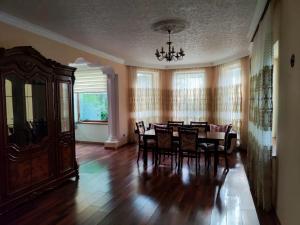 a dining room with a table and chairs and a chandelier at Villa Nabran in Nabran