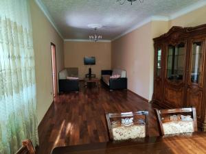a living room with two chairs and a table at Villa Nabran in Nabran