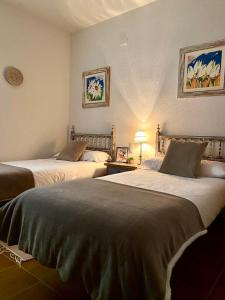 two beds sitting in a room with at Villa Sanz in Cuenca +86 photos