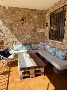 a living room with a couch and a table at Villa Sanz in Cuenca