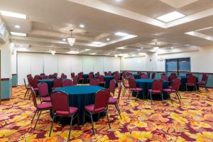 a conference room with tables and chairs in it at MCM Elegante Suites Abilene in Abilene +20 photos