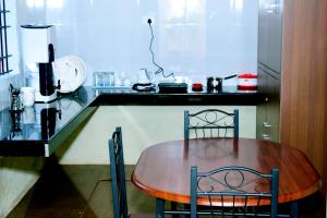 Kuchyň nebo kuchyňský kout v ubytování Holidayincoorg Cozy Nest