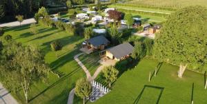 an aerial view of a house in a park at De Limes Hoeve Safaritent A1 in Ingen