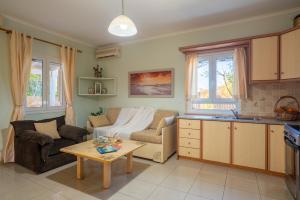 a living room with a couch and a table at Casa Carina in Lakíthra