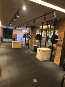 a gym with lots of equipment in a room at SeuLoft 110SouMais in Niterói