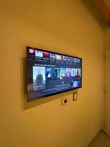 a flat screen tv hanging on a wall at Dormis H35 in Ataliva Roca