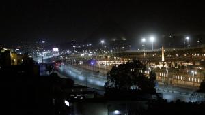 a city lit up at night with street lights at Giza Pyramids& GYM View in Cairo +2 photos