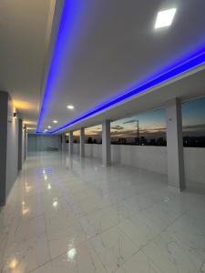 an empty building with blue lights on the ceiling at Serenity House in Santa Marta