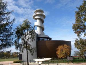 a building with a lighthouse on top of it at Studios near Beach in Balatonfoeldvar 18525 in Balatonföldvár