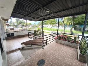 an empty building with a view of a park at Denier House Guabinal - Cerca de Centros Comerciales in Ibagué