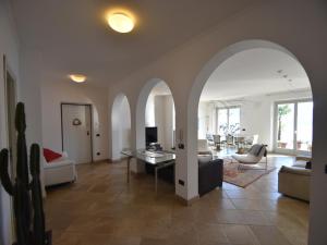 a living room with a couch and a table at Villa with Panoramic Views for 6 in Oggebbio