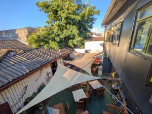 an overhead view of a building with a tent outside at Hostel INK - Duerme Como En Casa in Concepción +44 photos