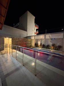 a view of a swimming pool at night at Serenity House in Santa Marta
