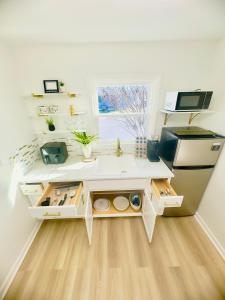 a kitchen with a white counter and a sink at The Blue House in Dover