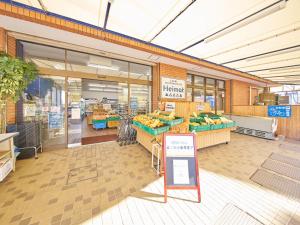 a grocery store with fruits and vegetables on display at マーケットステイ串本 MarketStay Kusimoto in Kushimoto