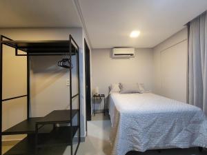 a small bedroom with a bed and a window at Way Bossa by Solis in João Pessoa