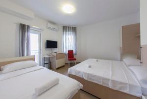 Postel nebo postele na pokoji v ubytování Guesthouse Villa Klara