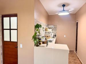 a kitchen with a white counter top in a room at Casa Zapata in Chano