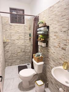 a bathroom with a toilet and a sink at Casa Zapata in Chano +10 photos