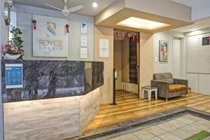 a lobby of a house with a waiting room at Collection O Royce Studios Near Pune Airport in Pune