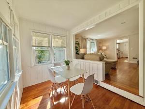 a living room with a table and chairs and a couch at North Haven Rooms in North Haven +27 photos