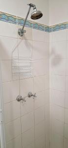 a shower with a shower head in a bathroom at Sussex Shores in Sussex Inlet +37 photos