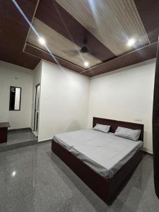 a bedroom with a bed in a room at Panwar home stay in Partābnagar