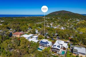 an aerial view of a town with a soccer ball on a pole at Hilltop Hideaway at Coolum Beach in Coolum Beach