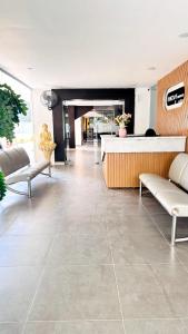 a living room with a large tile floor at Innzoy Comforts - Hitech City Hyderabad in Hyderabad