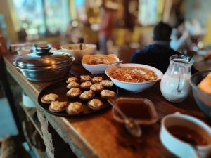a table topped with plates of food and bowls of food at Šumska 1 - Fruška gora in Sremska Kamenica