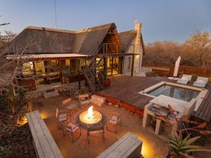 an aerial view of a house with a patio and a pool at Ntoma House in Hoedspruit