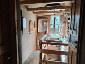 a view of a room with a staircase in a tiny house at Šumska 1 - Fruška gora in Sremska Kamenica +42 photos
