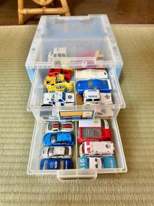 a plastic container full of toy cars and trucks at イトノ-itono- in Goto