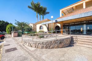 a building with a staircase in front of a building at Maspalomas Green Oasis 1404 in Maspalomas