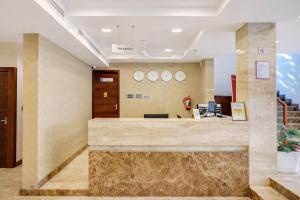 an office lobby with a marble reception desk at Soorya in Attingal