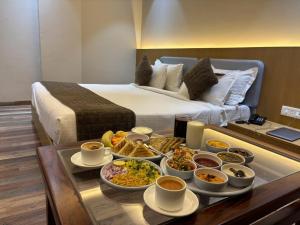 a tray of food on a table in a hotel room at Hotel Fortune Mandsaur in Mandsaur