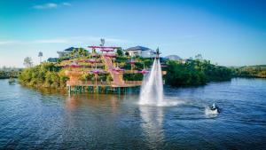 a fountain in the water in front of a water park at Lamori Resort & Spa, Thanh Hoá in Thanh Hóa