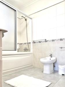 a bathroom with a shower and a toilet and a sink at "Fifi House" in Estreito da Calheta +50 photos